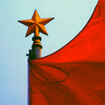 red flag star flagpole sky