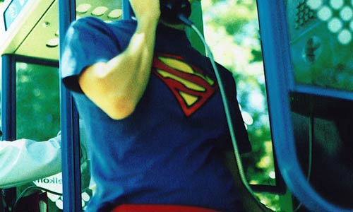 skinny nerd superman imposter at phone booth